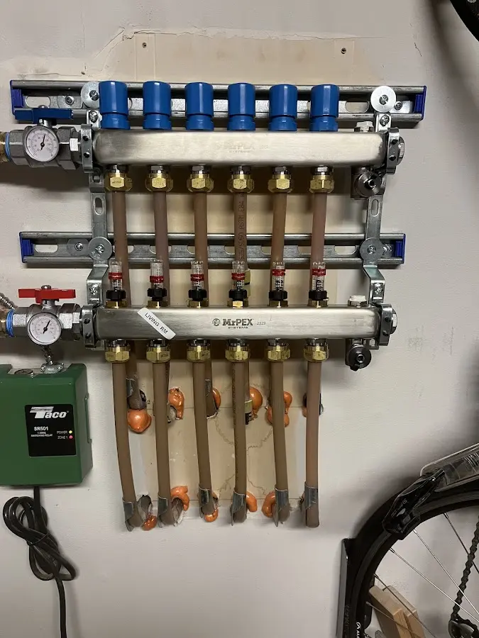 Plumber performing Water Heater Repair at a residential property in Waldron